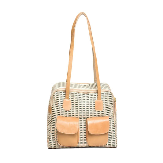 Canine Styles beige modern dog carrier made of see through mesh material and beige colored leather trim. Over the shoulder pet purse with two front pockets.