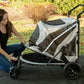 Person is lifting the canopy of the Pet Gear Expedition dog stroller.