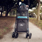 Front view of the Petique Double Decker pet stroller with a cat sitting inside.