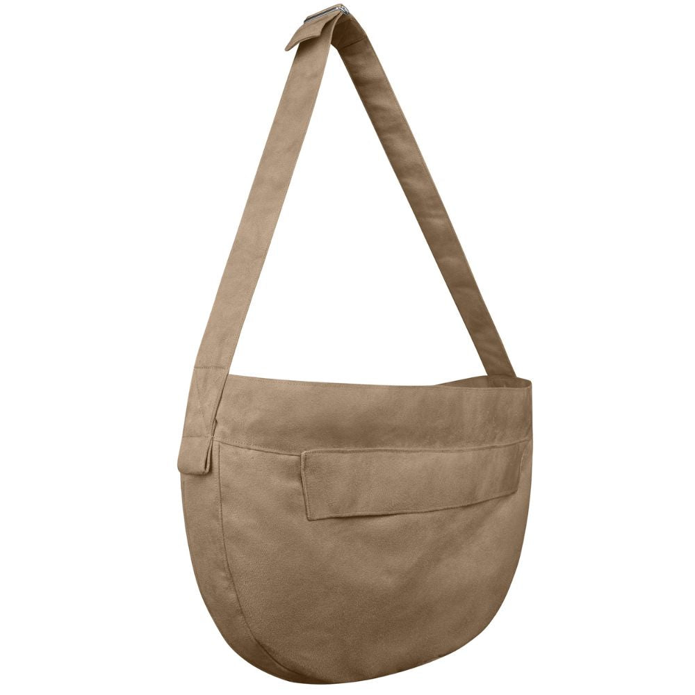 Side angle of a Susan Lanci Dog Cuddle Carrier purse in dark taupe color with a shoulder strap.