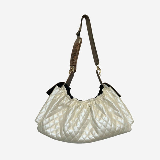 The Petote Gigi over the shoulder dog carrier purse in quilted ivory.